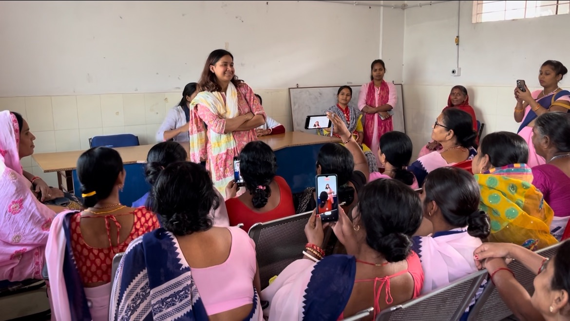 An MJWF facilitator in conversation with women during a health session.